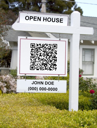 real estate yard sign displaying a QR code